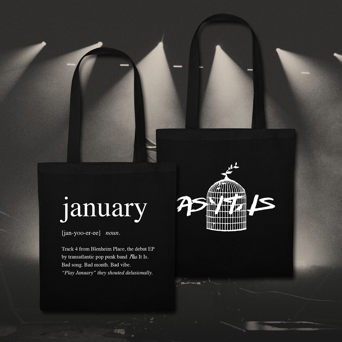 Two black January tote bags featuring stylish white designs