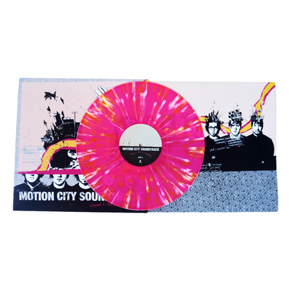 Vibrant pink and orange tie-dye vinyl record with black center label for motion city soundtrack commit this to memory lp
