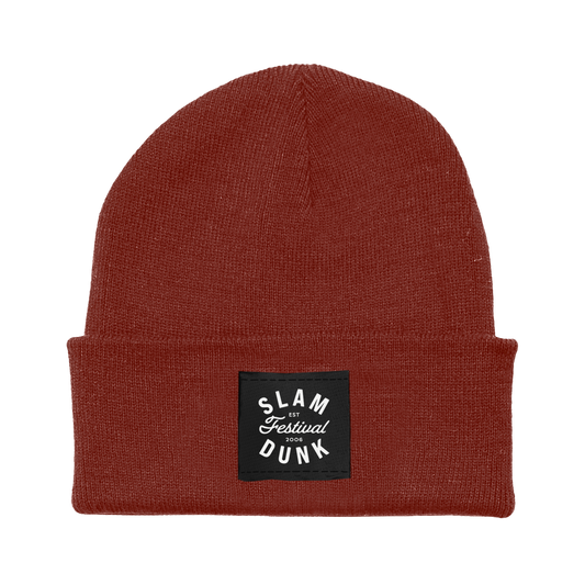 Rust-colored knit beanie with black patch and white slam festival dunk 2006 text since 06 beanie rust