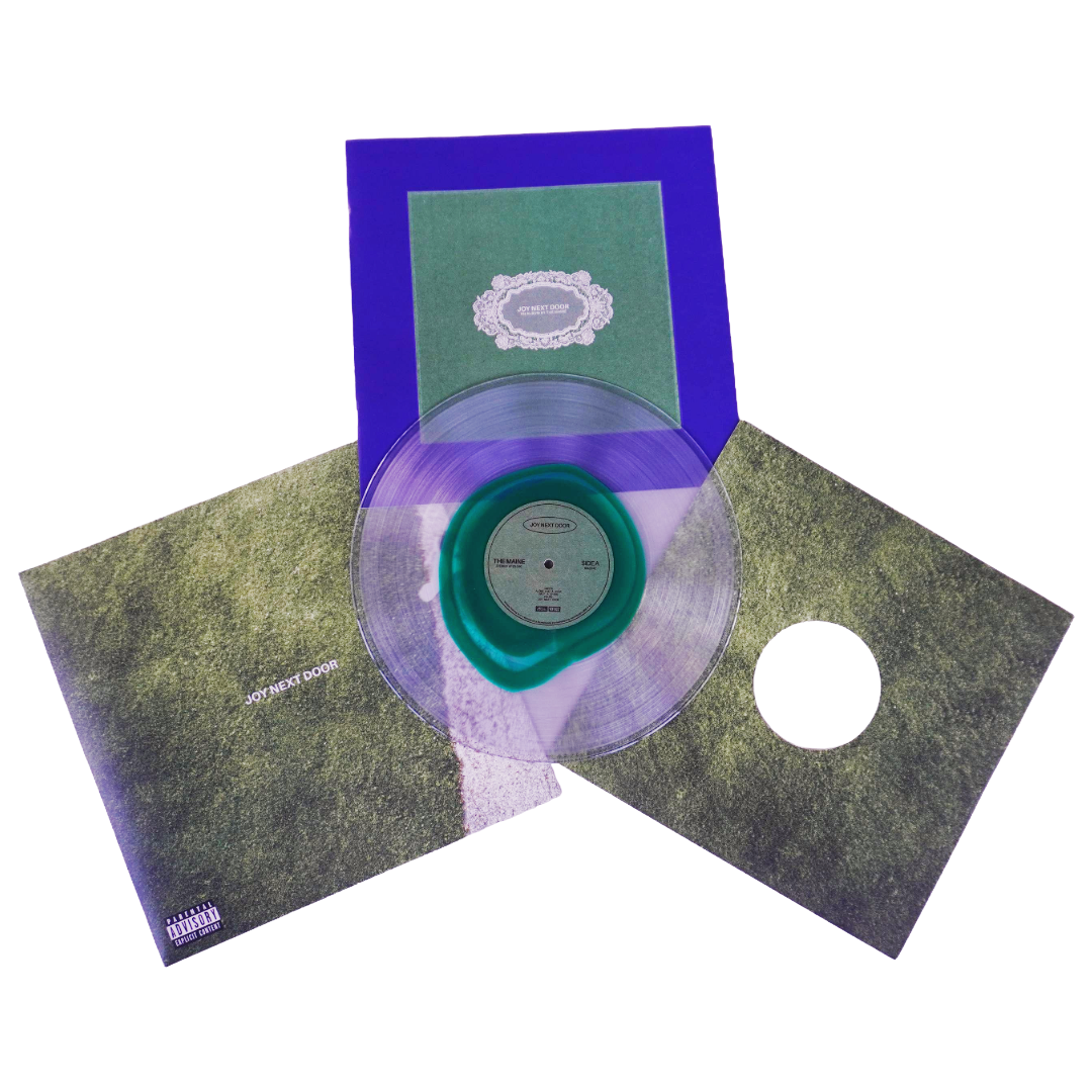 The maine joy next door lp with a translucent purple vinyl record and glass clear green center label in matching sleeve